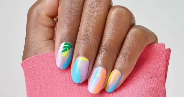 Summer beach vacation manicure with colorful abstract art. 