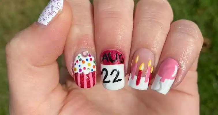 Cute birthday nail art with red and white nail colors. 