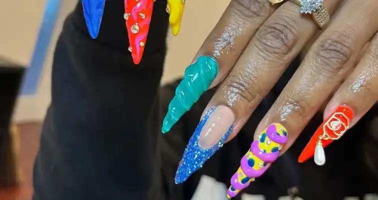 Long almond stiletto nails with 3D colorful gel nail art. 