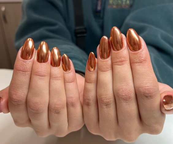 November manicure with copper chrome nail color. 