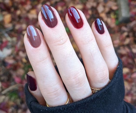 Maroon and brown skittle nails for November. 