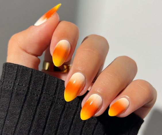 Airbrush gradient nail art with orange and yellow nail colors