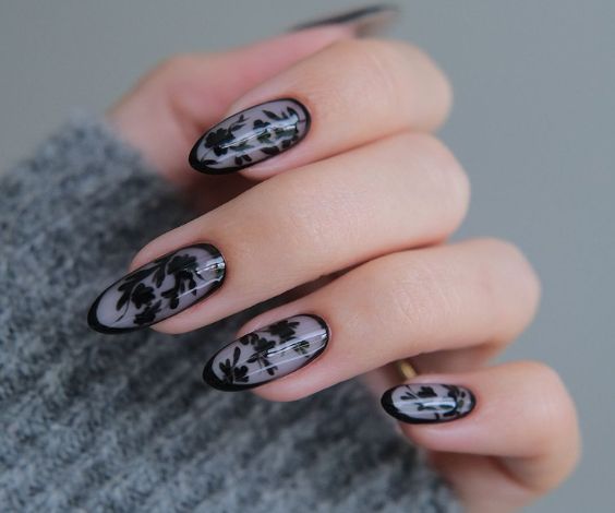 Black and gray nails with leafy patterns