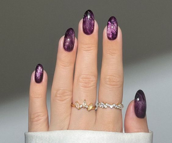 Winter almond nails with burgundy ombre effect.