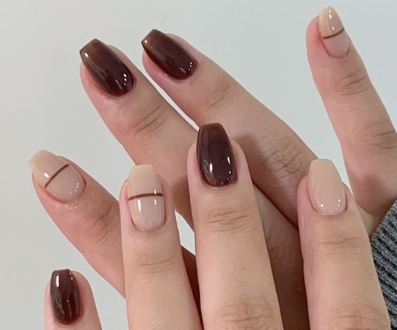 Glossy chocolate brown nails with stripe nail art