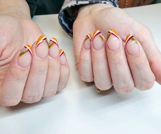 Striped French tips nail art with fall nail colors. 