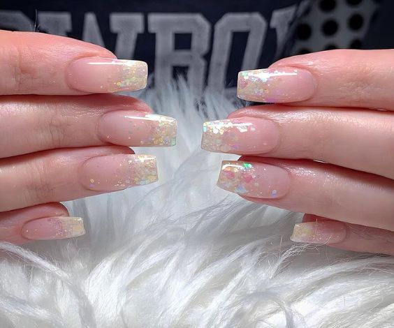  November ombre nails with silver holographic glitters. 