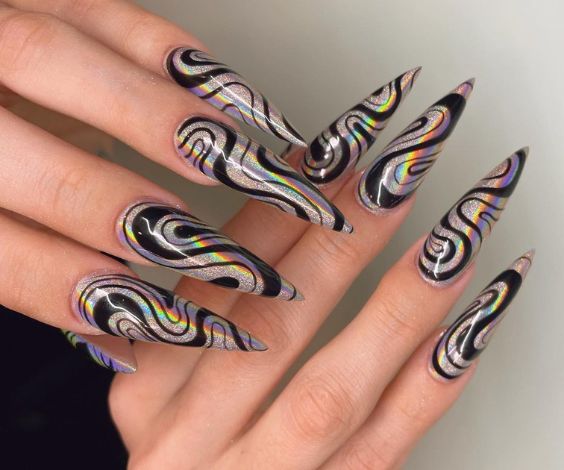 Groovy nail art on silver stiletto nails for November. 