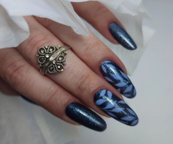 Blue leafy winter nails with glitter nail paint