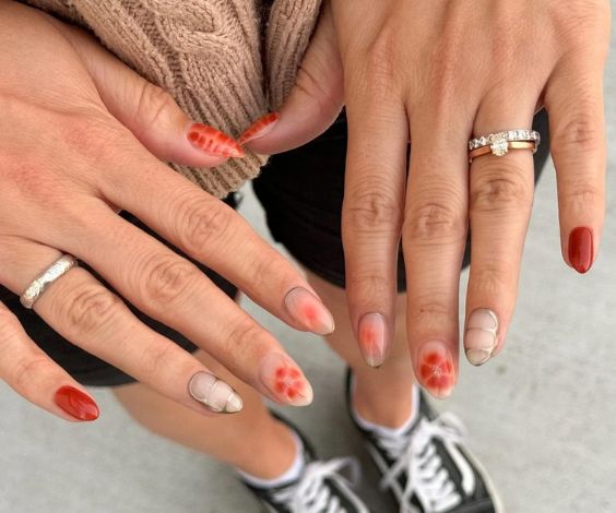 Mix and match nail art with orange nail color and metallic accents. 